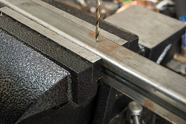 istock Drilling steel tube on the bench vise 638100764