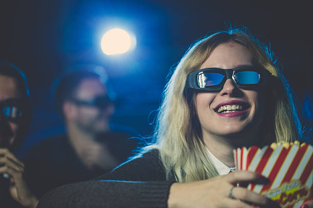 istock Blonde girl in cinema 638101036