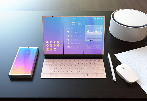 Smart phone, tablet PC, digital pen, keyboard and voice assistant Smart phone, tablet PC, digital pen, keyboard and voice assistant on a dark wood table. The tablet showing home energy management information. 3D rendering image. detachable stock pictures, royalty-free photos & images