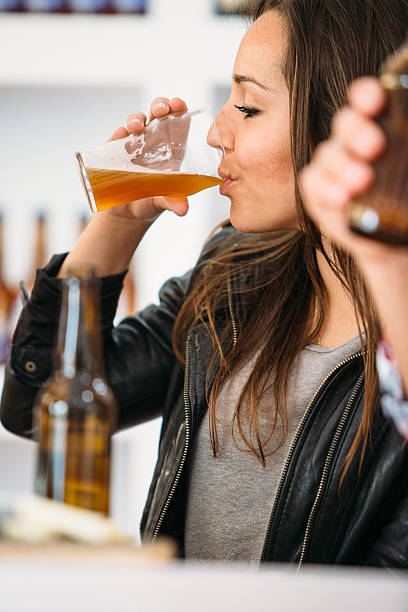 istock Side view of woman drinking beer 638103580