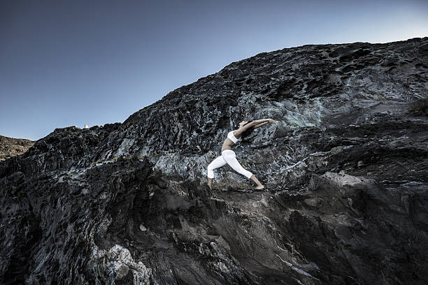 istock Woman doing yoga exercises in nature 638105294