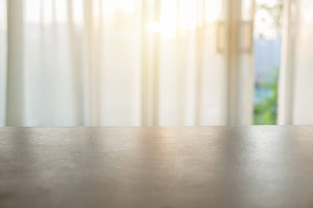 istock Wood table top on blurred soft curtain 638106336