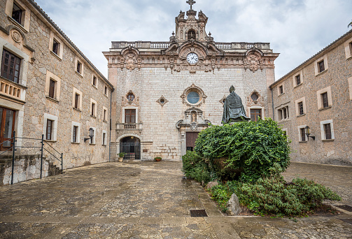 Memorial to bishop Pere-Joan Campins in cloistered courtyard of Santuario de lluc Monastery, county of Escorca in basin of the Serra Tramuntana Mountains on Mallorca