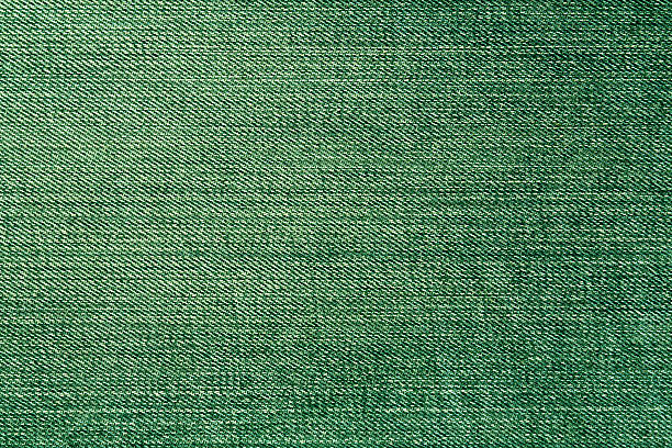 istock Green color denim close up. 638107872