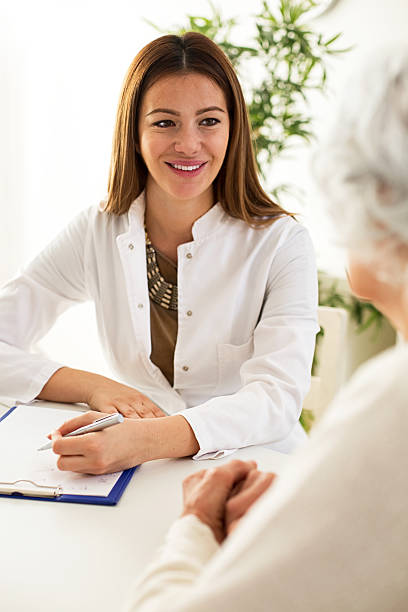 istock Senior woman visiting a doctor 638110598