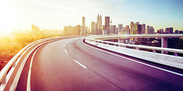 istock Highway overpass motion blur with city background 638110820