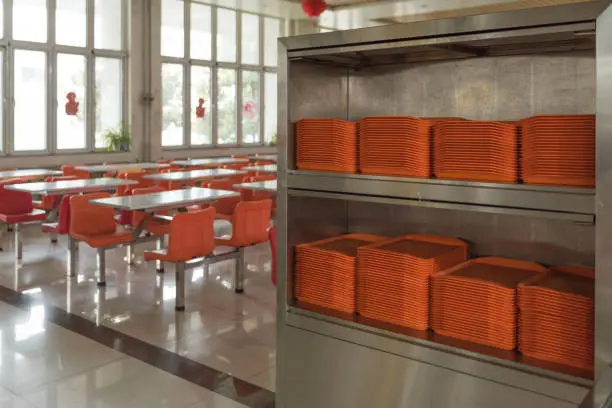 Photo of orange plates in mess hall