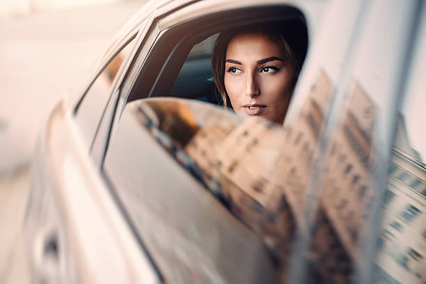istock Beautiful Woman Inside of A Car 638112674