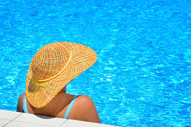 istock Real female beauty relaxing at swimming pool 638113028