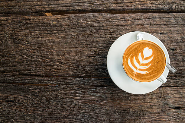 istock Cup of hot coffee latte on the wood table. 638113768