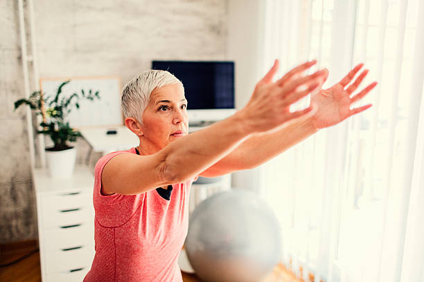 istock Mature Woman Exercising At Home. 638116060