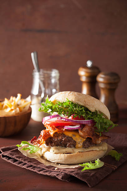 istock bacon cheese burger with beef patty tomato onion 638116302