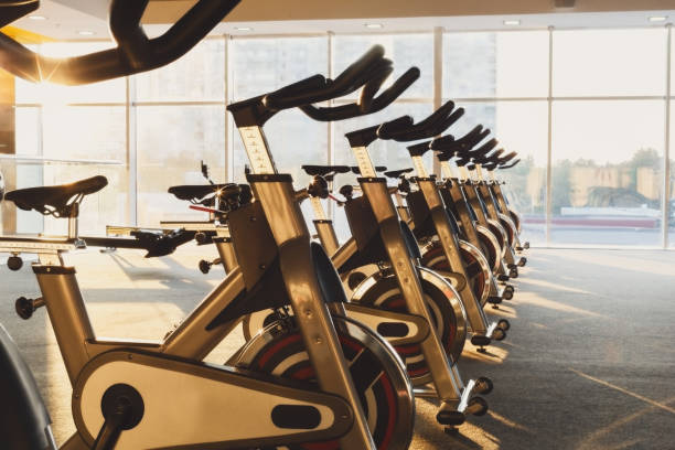 istock Modern gym interior with equipment, fitness exercise bikes 638116412