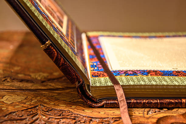 istock Opened vintage book with the silk laying. Handmade leather cover. 638118548