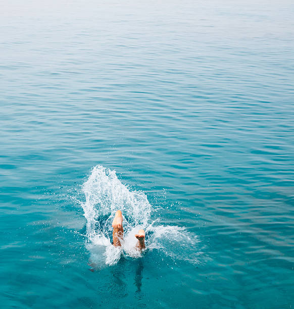 istock Legs sticking out of water 638119272