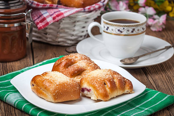 istock Buns with berries on a wooden table. 638119302