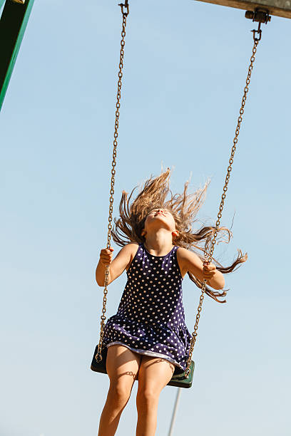 istock Playful crazy girl on swing. 638119396