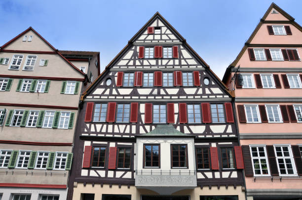 istock Front view of three old typical half-timbered houses with shutters. 638121296