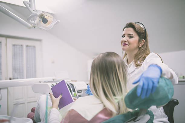 istock Dentist curing a female patient 638123620