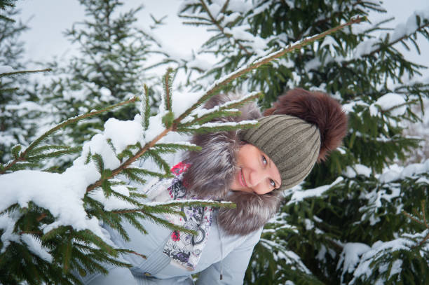 istock woman at the winter tree 638124002