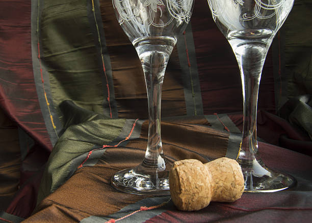 istock Two empty glasses of champagne and the cork close-up 638124592