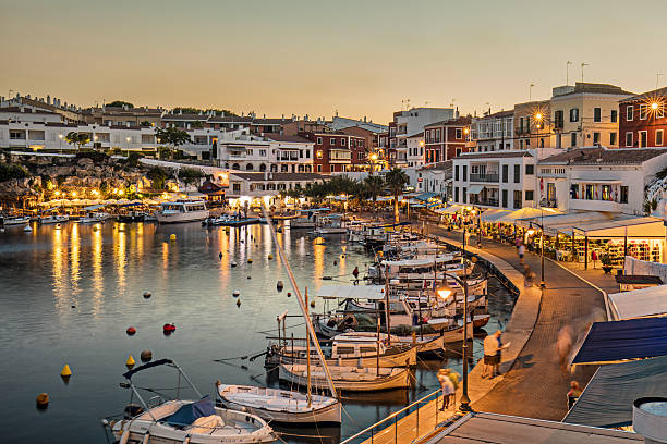 Es Castells town in Menorca Sunset in Es Castells bay in Menorca, Balearic Island, Spain. minorca photos stock pictures, royalty-free photos & images