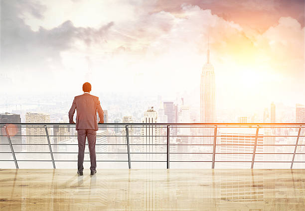 istock African man looking at sunlit New York 638126468