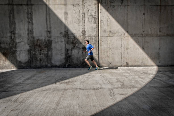 istock Side view male runner concrete arcades 638126682