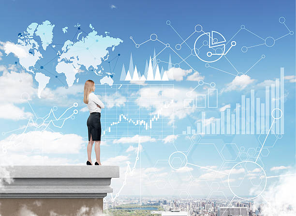 istock Woman looking at graphs and world map in the sky 638126704