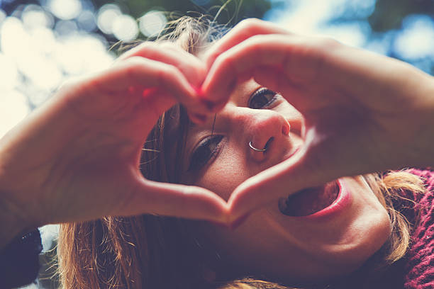 istock Girl making a heart-shape outdoors. 638127892