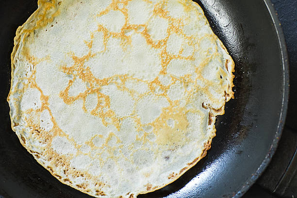 istock pancake in a metal black frying pan 638127950
