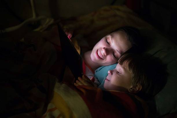istock Mother and son playing on tablet 638128422