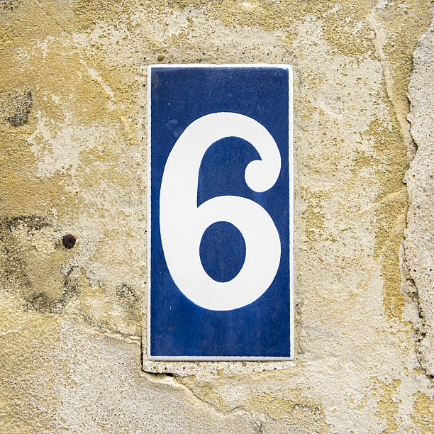 No. 6 House number six on a ceramic tile. White lettering on a blue background ceramic tile house numbers stock pictures, royalty-free photos & images