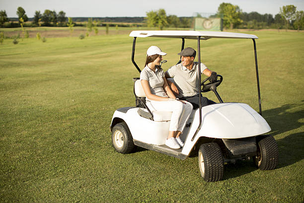 istock Young couple at golf cart 638130736