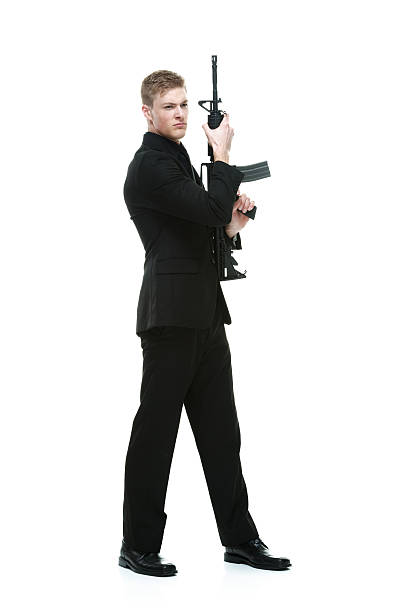 istock Businessman holding rifle 638131016