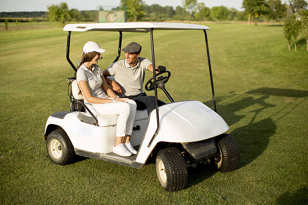 istock Young couple at golf cart 638131266