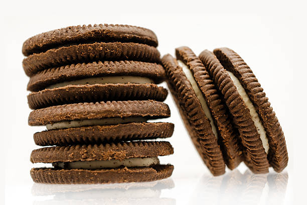 istock Chocolate cream cookies on white background 638131416