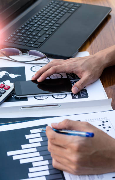 istock Business workers discussing digital graphs and diagrams indicati 638131928