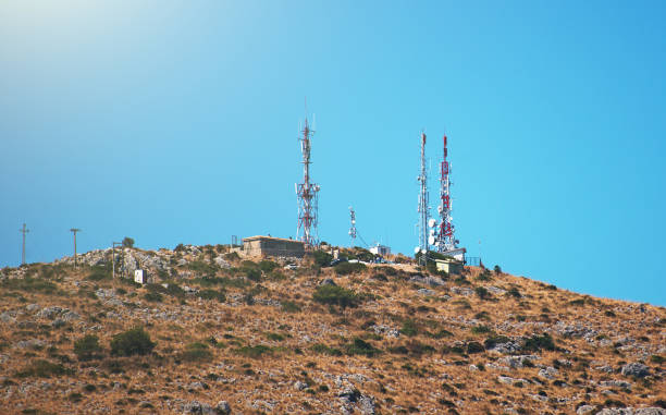 istock Telecommunication towers with antennas at sunset. 638131994
