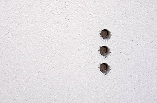 istock floor texture three holes on the wall abstract background 638132968