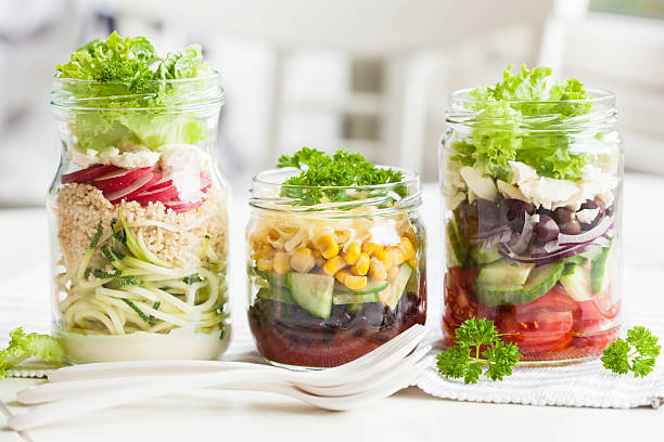 istock healthy vegetable cheese salad in mason jars 638134000