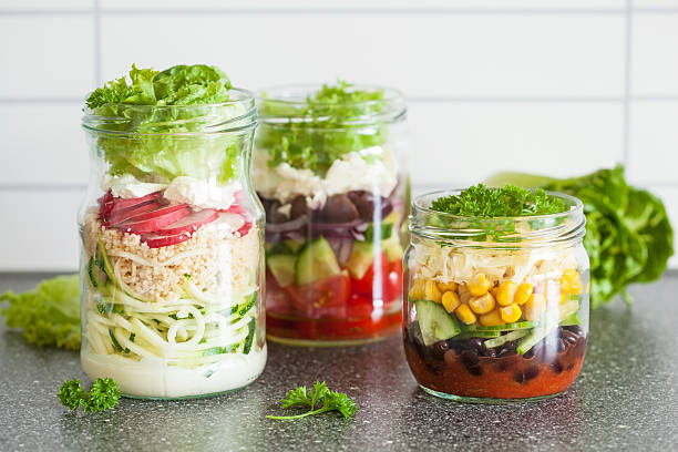istock healthy vegetable cheese salad in mason jars 638134116