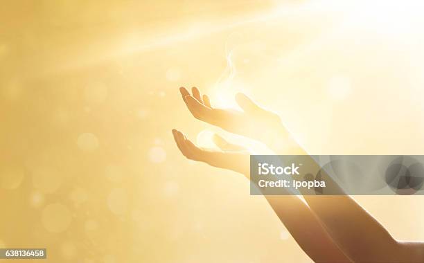 Woman Hand Praying For Blessing From God On Sunset Background Stock Photo - Download Image Now