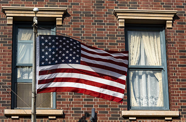 istock American flag in front of a city 638139520