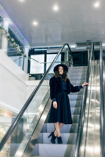 istock The girl on an escalator in a big store 638142810