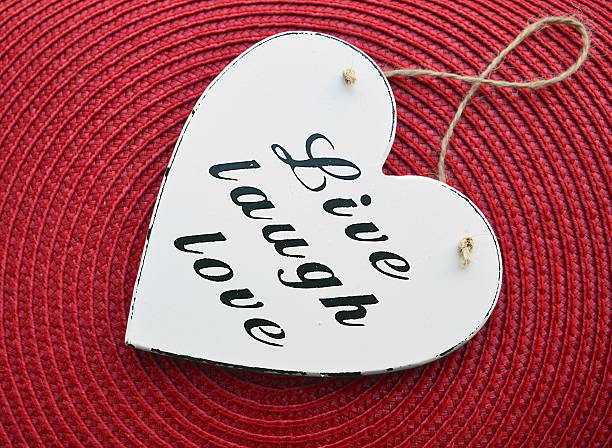 istock Live,Laugh,Love.Decorative white wooden heart. 638143120