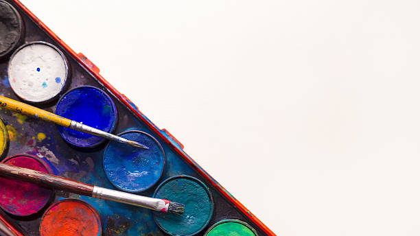istock Water color pallet two paint brushes with white background 638150220