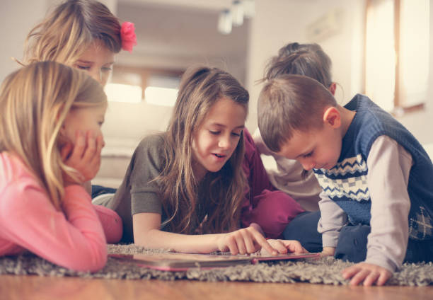 istock Large group of children lying on the floor. 638151810