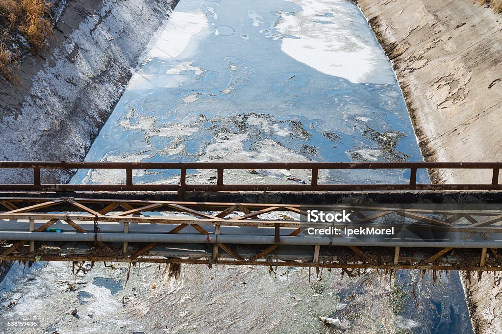 View of waste-water, pollution and garbage in a canal Bacterium Stock Photo
