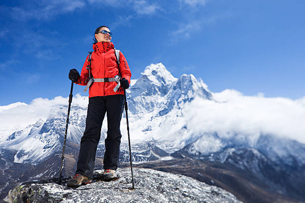 istock Woman looking at view, Mount Ama Dablam on background 638160002